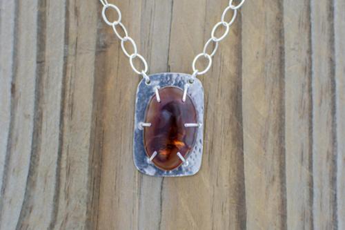 Fire agate on sterling silver prong setting