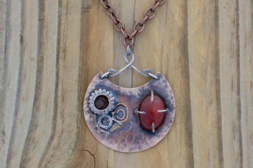 Bi-metal fusing on copper with carnelian prong set and sterling silver bail